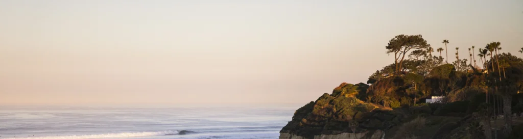 Elevated view of Encinitas coastline at dusk, representing peace, healing, and recovery support from San Diego Wellness Center.