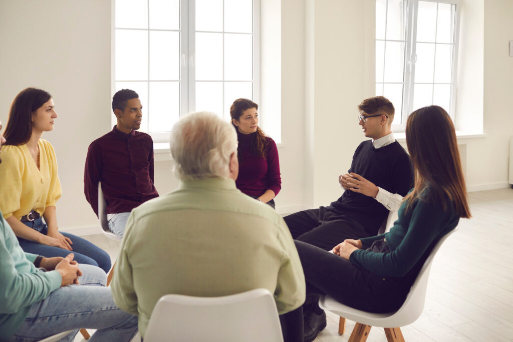 Group therapy session focused on dialectical behavior therapy (DBT) skills like mindfulness and emotional regulation.