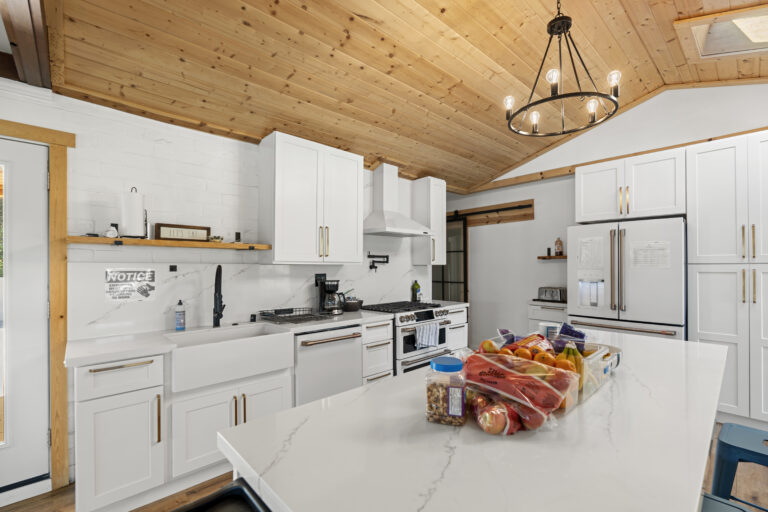 All white and marble secondary kitchen of the SD-Wellness Drug Rehab Facility in Ironwood, CA.