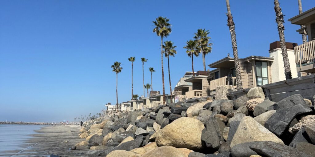 houses on the water with rocks as the front view and palm trees. inpatient and outpatient program available at San Diego Wellness Center.